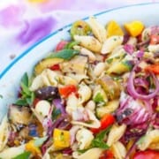 A serving dish filled with antipasto pasta salad.