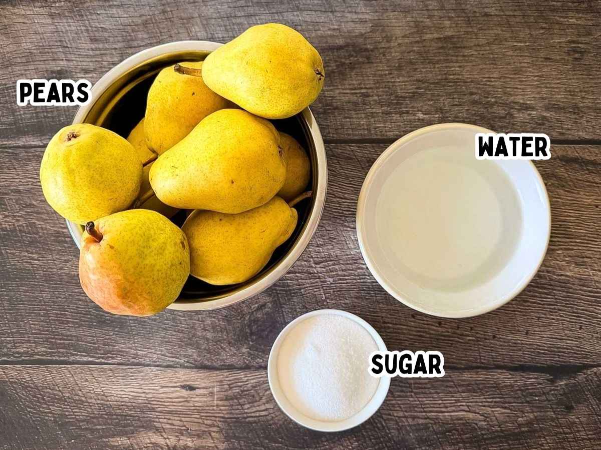 Labeled ingredients for canned pears in light syrup placed on a wooden table.