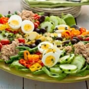 Salmon Nicoise salad on a large serving platter.
