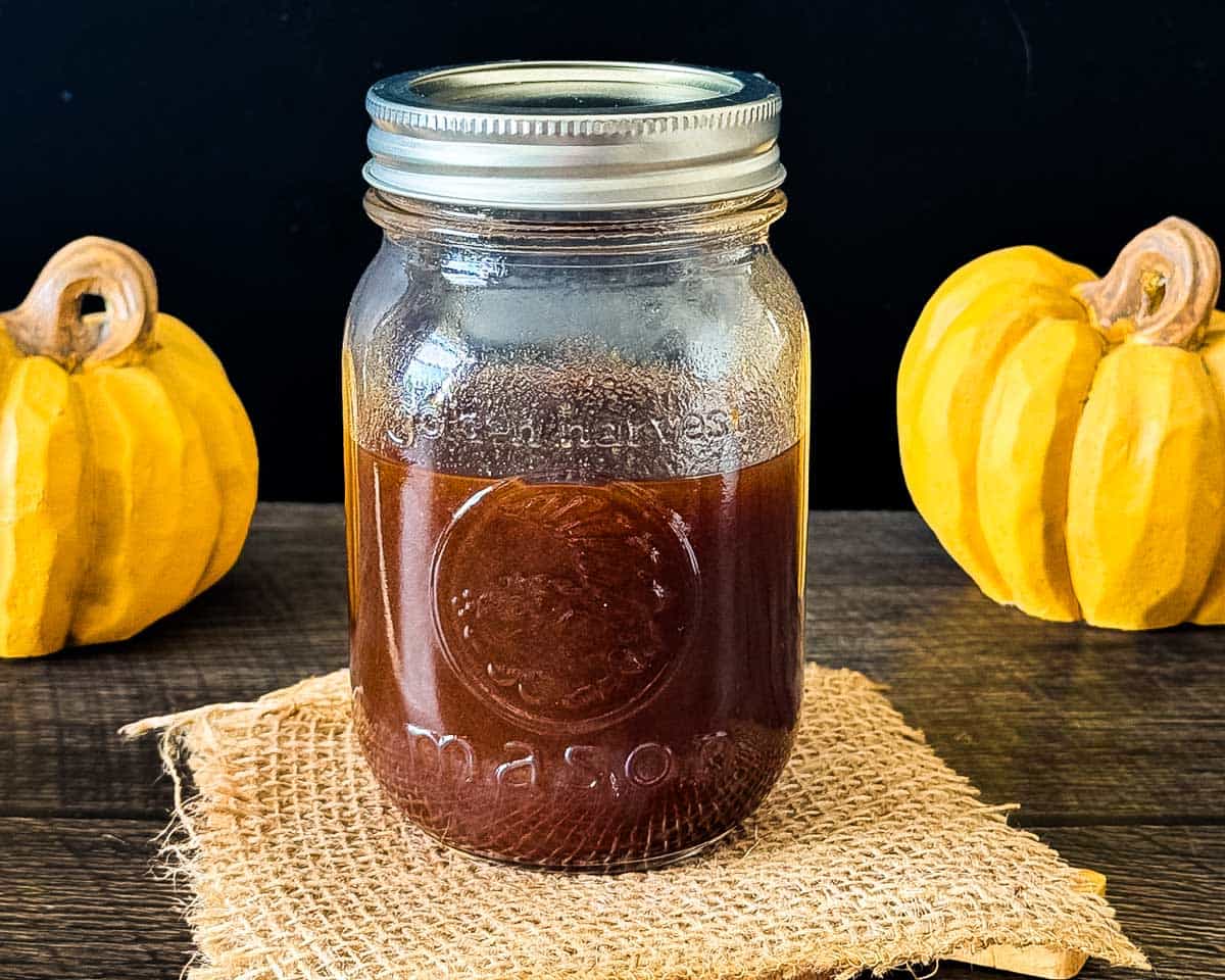 The finished pumpkin spice coffee syrup in a mason jar for storage.